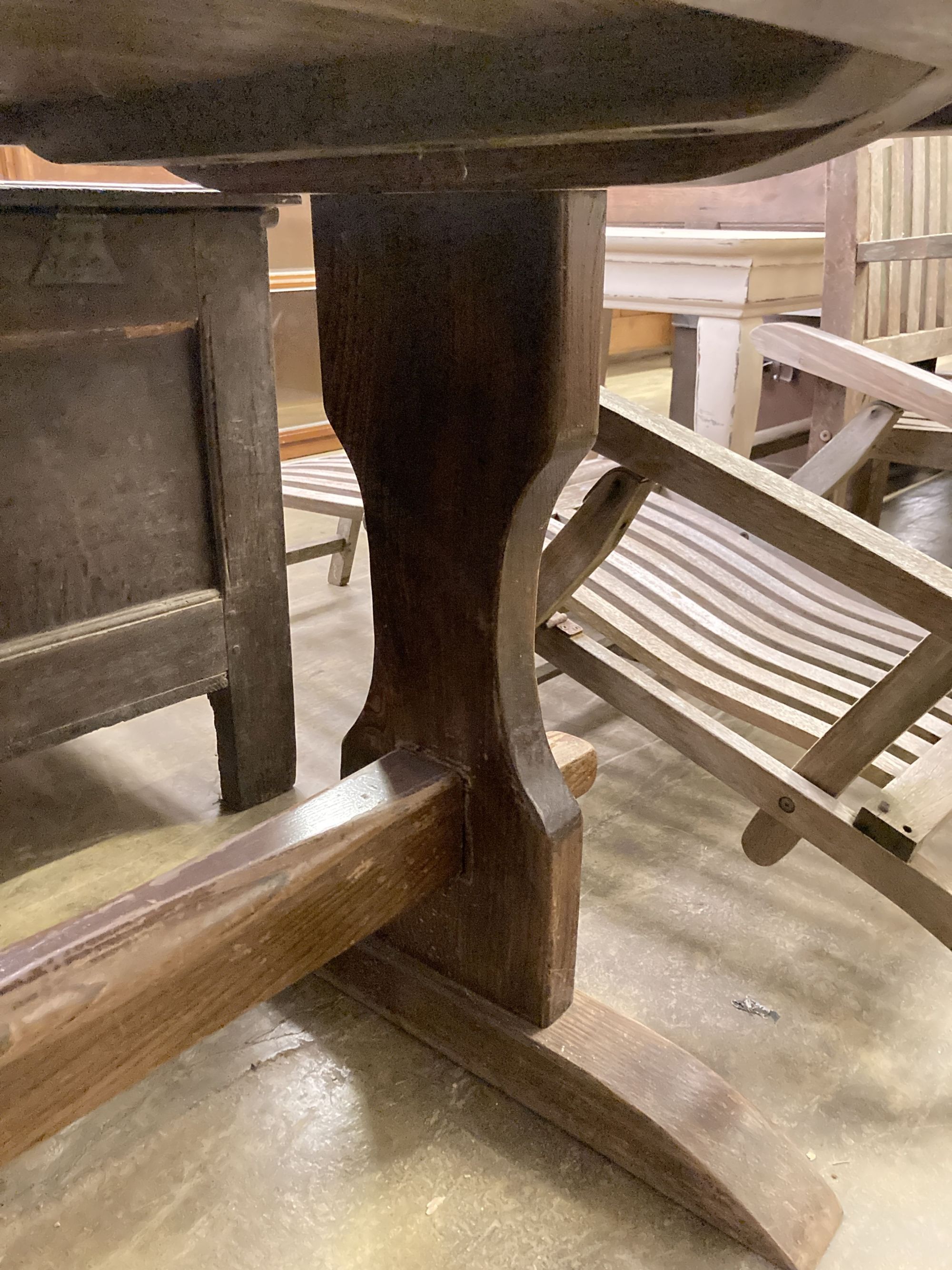 An 18th century style rectangular refectory dining table on trestle end supports, length 212cm, depth 80cm, height 74cm